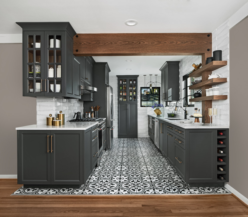 Inspiration for a transitional u-shaped multicolored floor kitchen remodel in Detroit with an undermount sink, recessed-panel cabinets, gray cabinets, white backsplash, stainless steel appliances, no island and white countertops