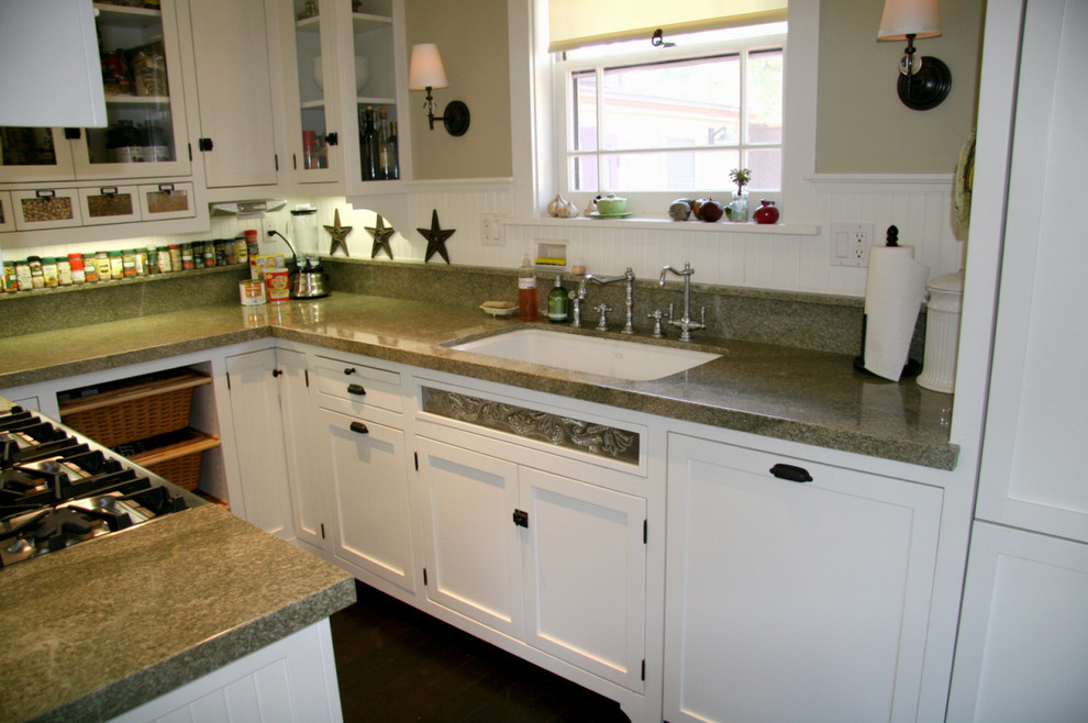 Arts and crafts galley eat-in kitchen photo in Los Angeles with an undermount sink, shaker cabinets, white cabinets, granite countertops, green backsplash, stone slab backsplash and paneled appliances