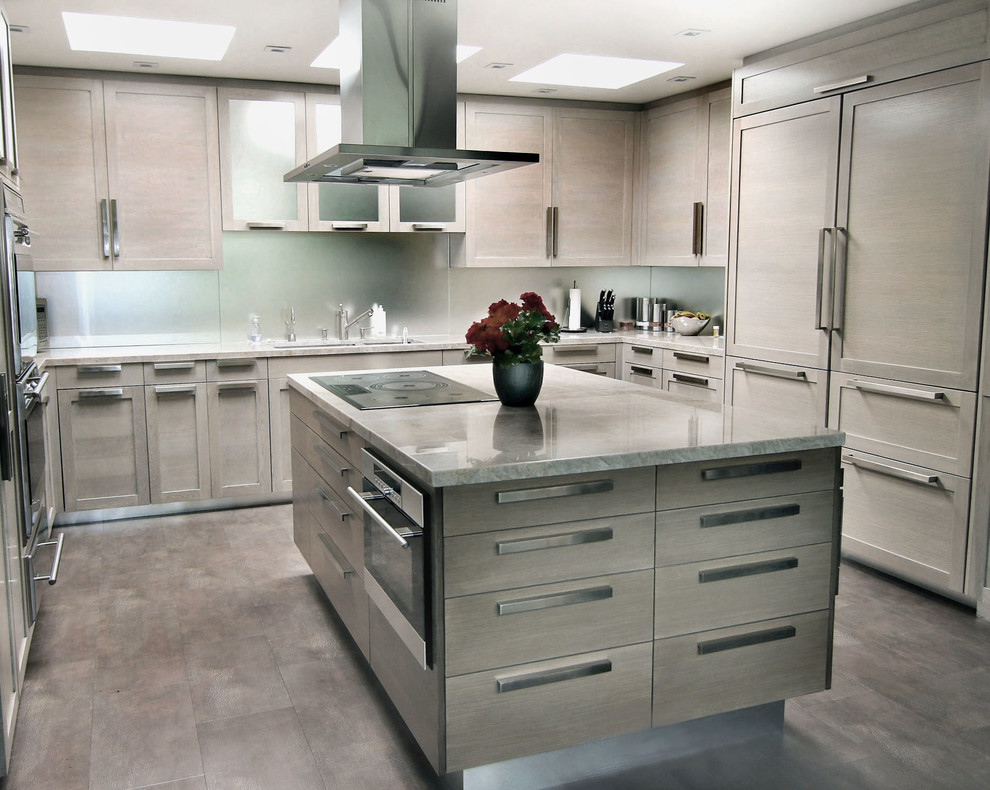 Eat-in kitchen - mid-sized modern u-shaped ceramic tile and gray floor eat-in kitchen idea in Los Angeles with a double-bowl sink, shaker cabinets, beige cabinets, quartzite countertops, metallic backsplash, glass sheet backsplash, paneled appliances and an island