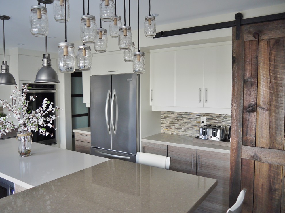 Example of a mid-sized trendy u-shaped porcelain tile open concept kitchen design in Toronto with an undermount sink, flat-panel cabinets, yellow cabinets, quartz countertops, glass sheet backsplash, stainless steel appliances and an island