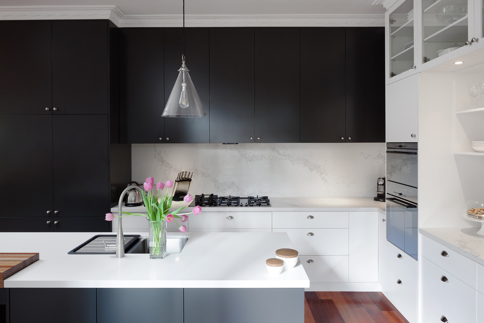 Example of a trendy kitchen design in Perth with an undermount sink, flat-panel cabinets, white cabinets, quartz countertops, white backsplash, stone slab backsplash, an island and white countertops