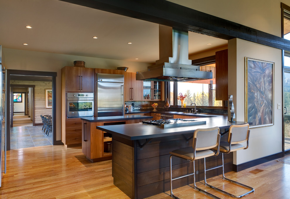 Design ideas for a contemporary u-shaped kitchen in Seattle with flat-panel cabinets.