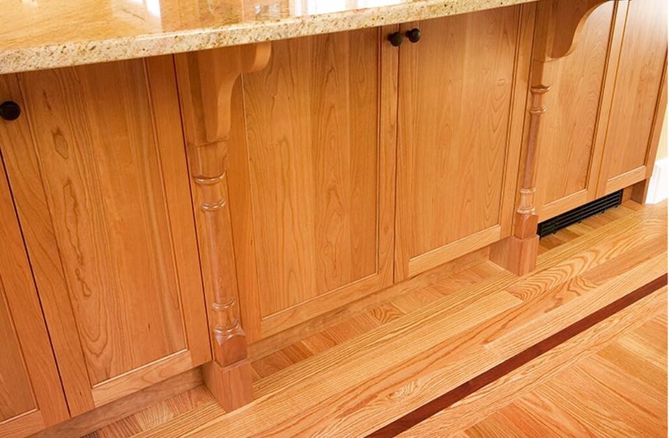 Mid-sized elegant galley light wood floor eat-in kitchen photo in Boston with granite countertops, an island, shaker cabinets and light wood cabinets