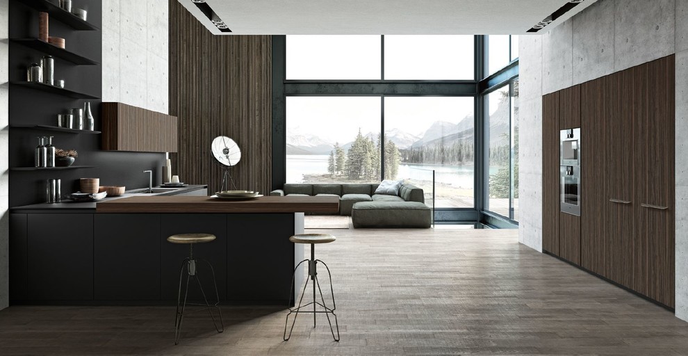 Inspiration for an expansive contemporary l-shaped open plan kitchen in San Francisco with a built-in sink, flat-panel cabinets, black cabinets, composite countertops, black splashback, stone slab splashback, integrated appliances, light hardwood flooring, no island, beige floors and black worktops.