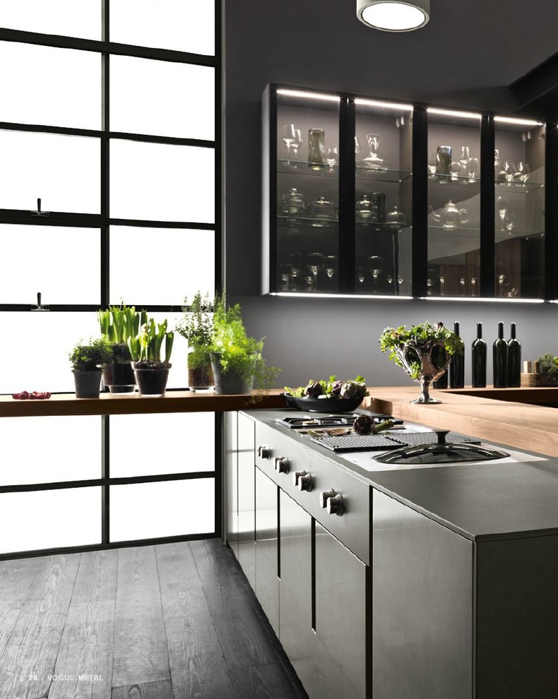 Inspiration for a large contemporary u-shaped dark wood floor and black floor eat-in kitchen remodel in San Francisco with an integrated sink, flat-panel cabinets, gray cabinets, wood countertops, gray backsplash, black appliances, a peninsula and brown countertops