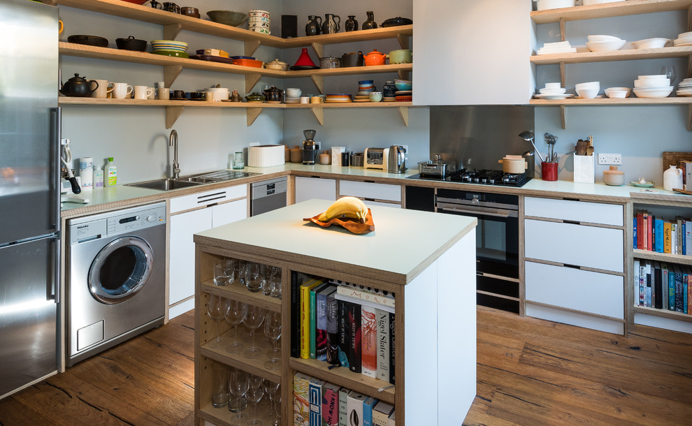 Inspiration for a medium sized retro l-shaped open plan kitchen in Other with light wood cabinets, wood worktops, stainless steel appliances, an island, medium hardwood flooring, brown floors and white worktops.