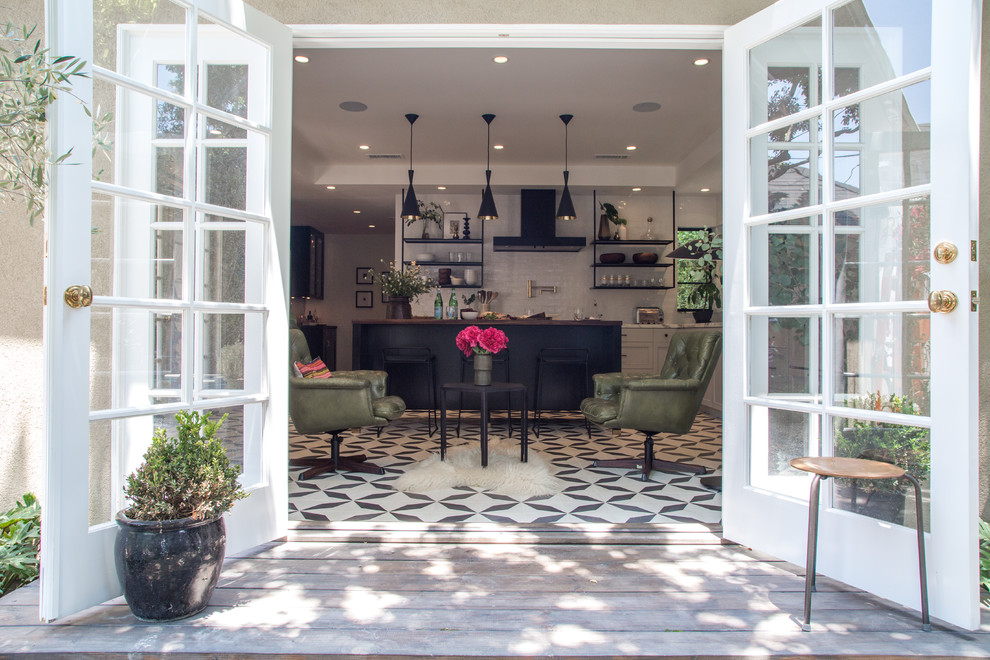 Large elegant cement tile floor and black floor eat-in kitchen photo in Los Angeles with a single-bowl sink, shaker cabinets, gray cabinets, marble countertops, white backsplash, ceramic backsplash, black appliances and an island