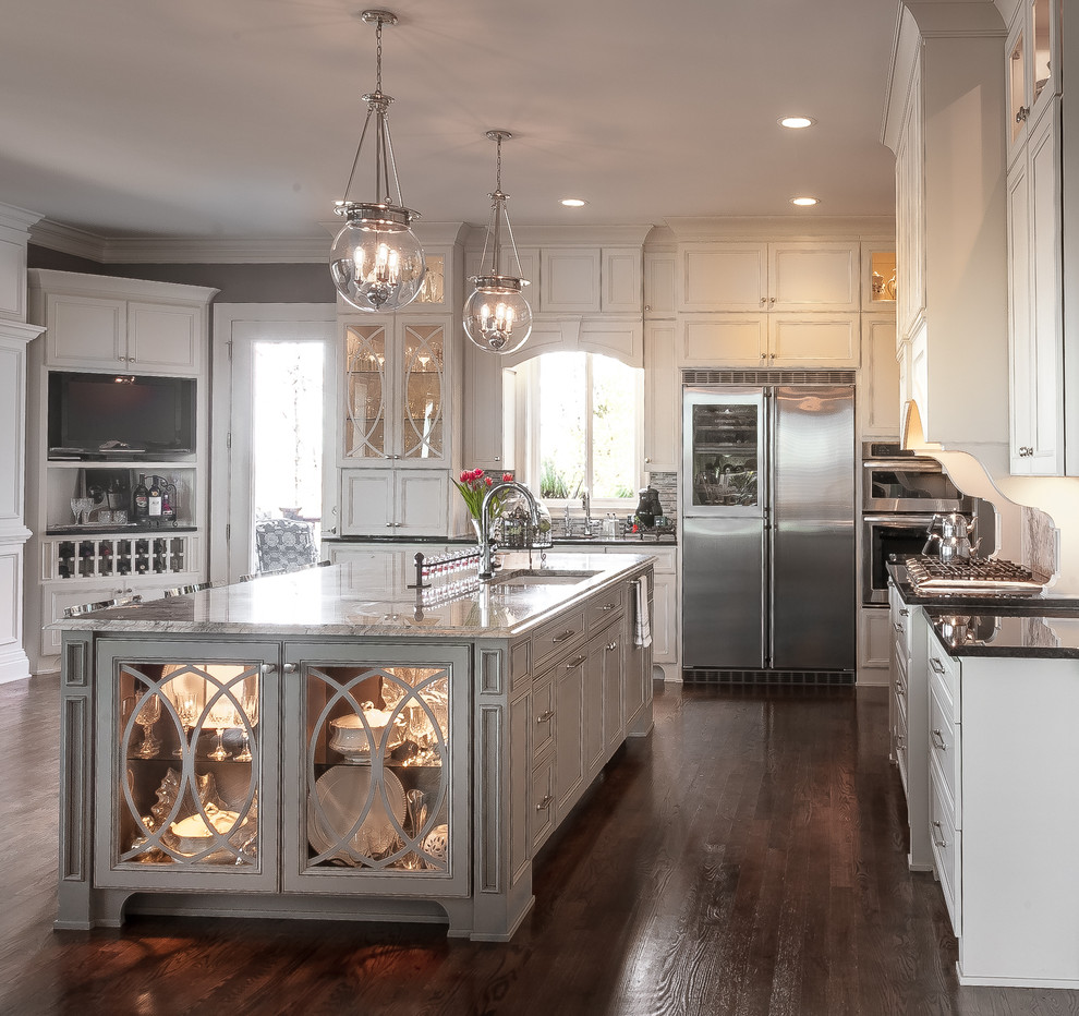 Inspiration for a large traditional kitchen in Atlanta with a single-bowl sink, recessed-panel cabinets, white cabinets, granite worktops, stainless steel appliances, dark hardwood flooring, an island and brown floors.