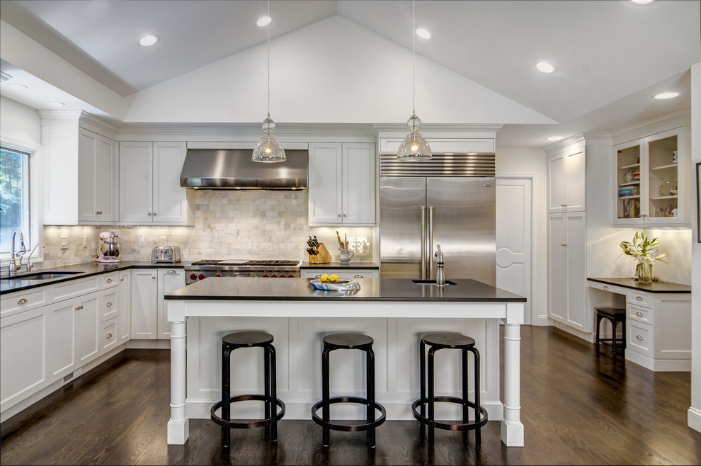 Example of a large classic l-shaped dark wood floor eat-in kitchen design in Other with an undermount sink, shaker cabinets, white cabinets, multicolored backsplash, stainless steel appliances, an island, granite countertops and marble backsplash