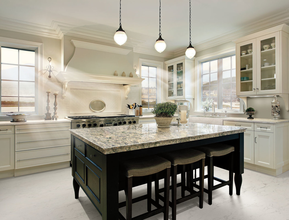 Large transitional l-shaped kitchen photo in Other with a farmhouse sink, recessed-panel cabinets, white cabinets, granite countertops, white backsplash, terra-cotta backsplash, stainless steel appliances and an island