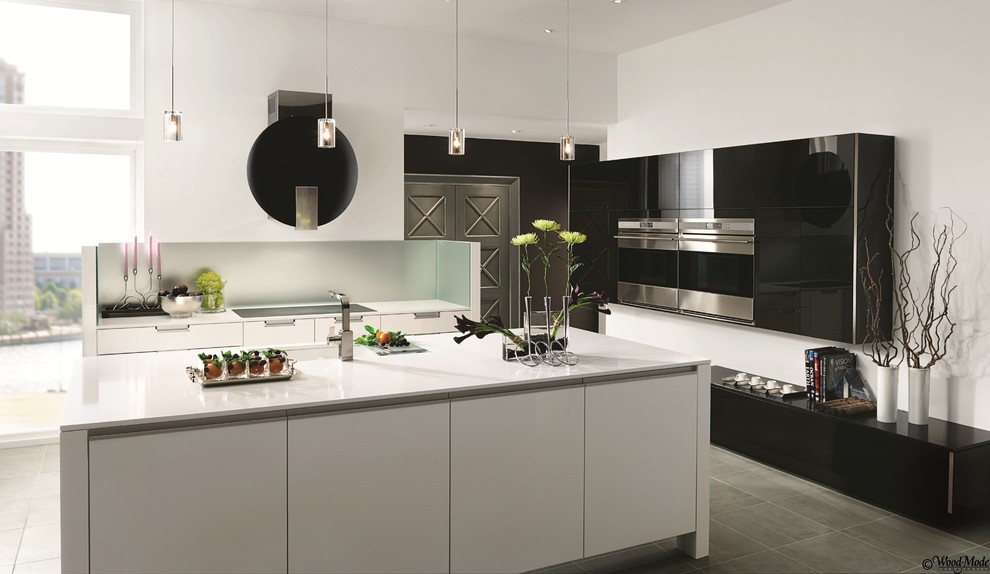 Example of a large trendy u-shaped ceramic tile eat-in kitchen design in Houston with flat-panel cabinets, white cabinets, stainless steel appliances and an island