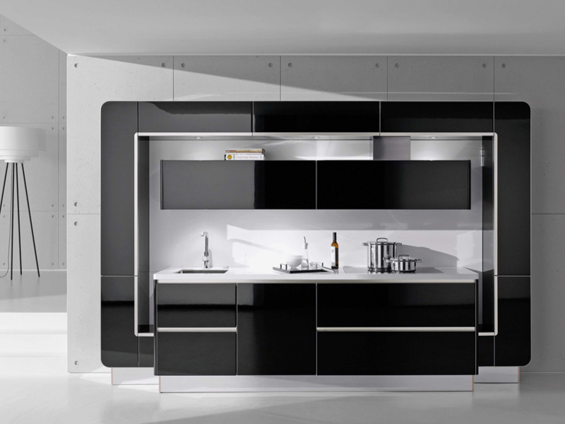 This is an example of a contemporary kitchen in London with black cabinets and glass-front cabinets.
