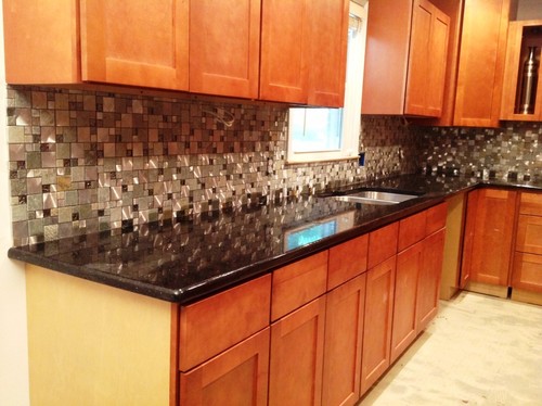 transitional New York kitchen featuring granite countertops