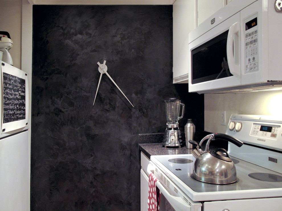 Example of an eclectic kitchen design in San Francisco with white appliances, raised-panel cabinets and white cabinets