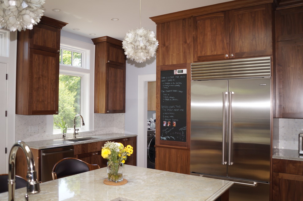Large modern l-shaped kitchen pantry in Boston with a single-bowl sink, flat-panel cabinets, brown cabinets, composite countertops, grey splashback, mosaic tiled splashback, stainless steel appliances, light hardwood flooring and an island.