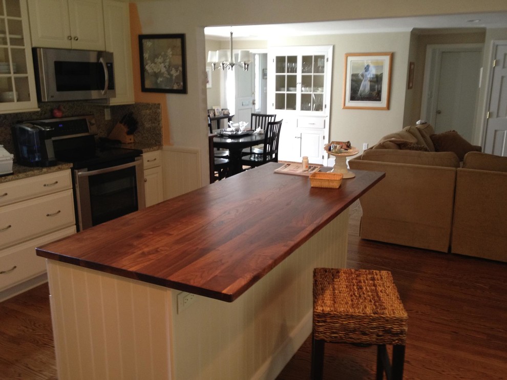Photo of a traditional kitchen in Atlanta with wood worktops.
