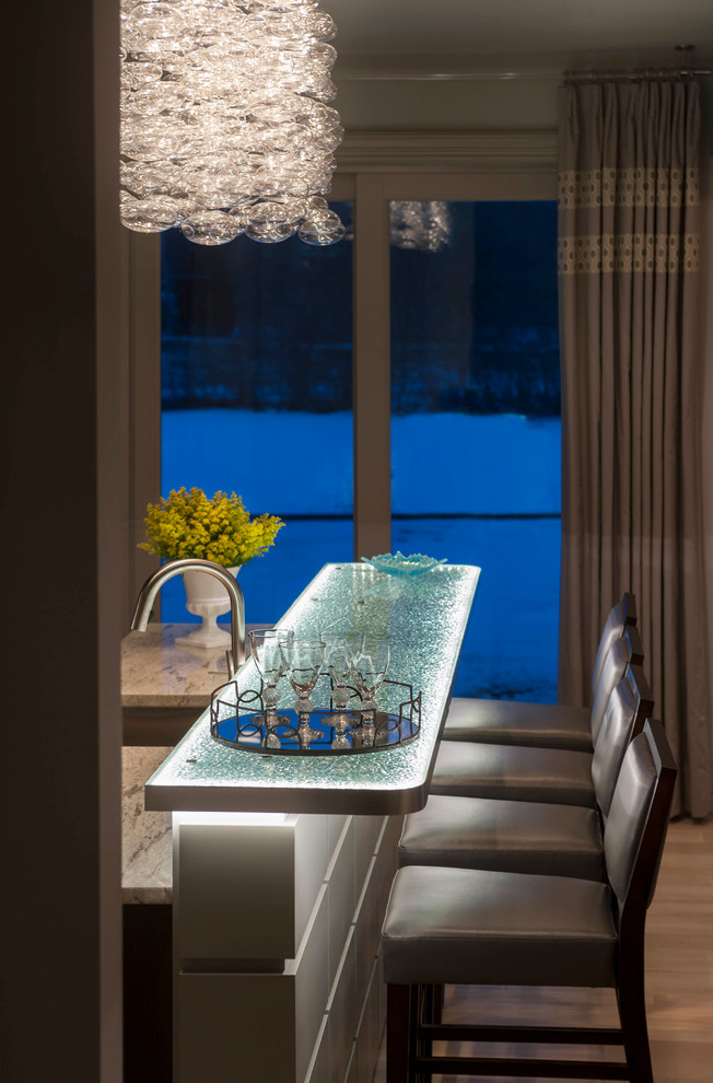 Example of a huge trendy galley ceramic tile eat-in kitchen design in Detroit with an undermount sink, raised-panel cabinets, glass countertops, stainless steel appliances, an island and turquoise countertops