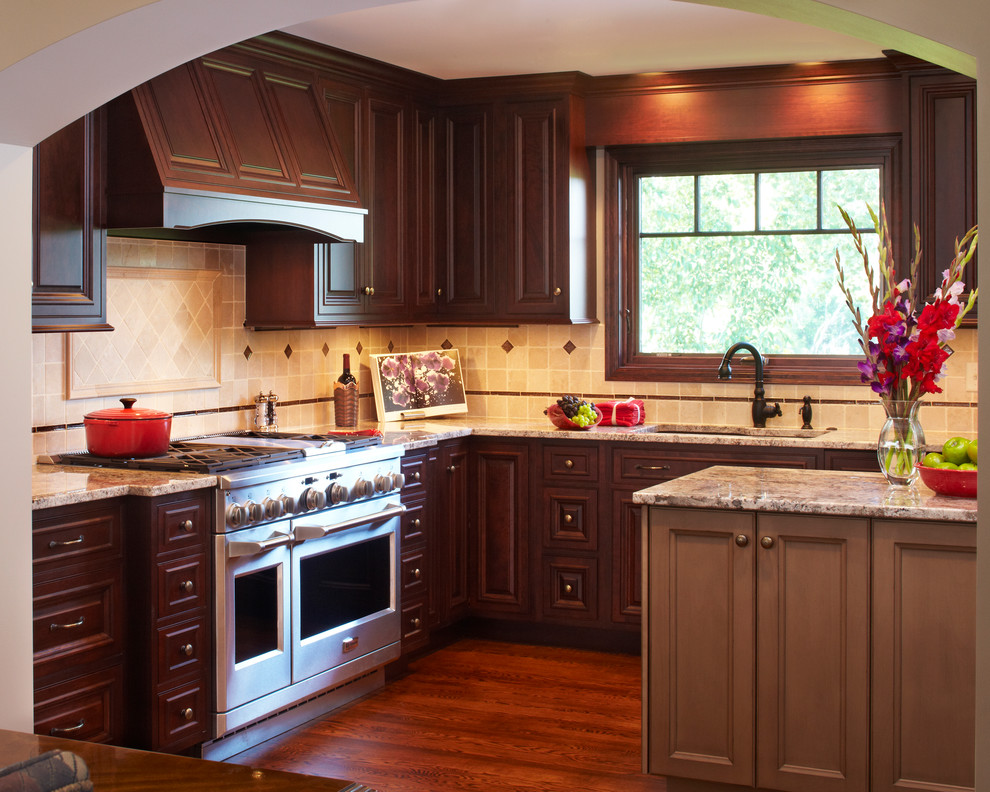 Inspiration for a timeless kitchen remodel in Minneapolis with dark wood cabinets and an island