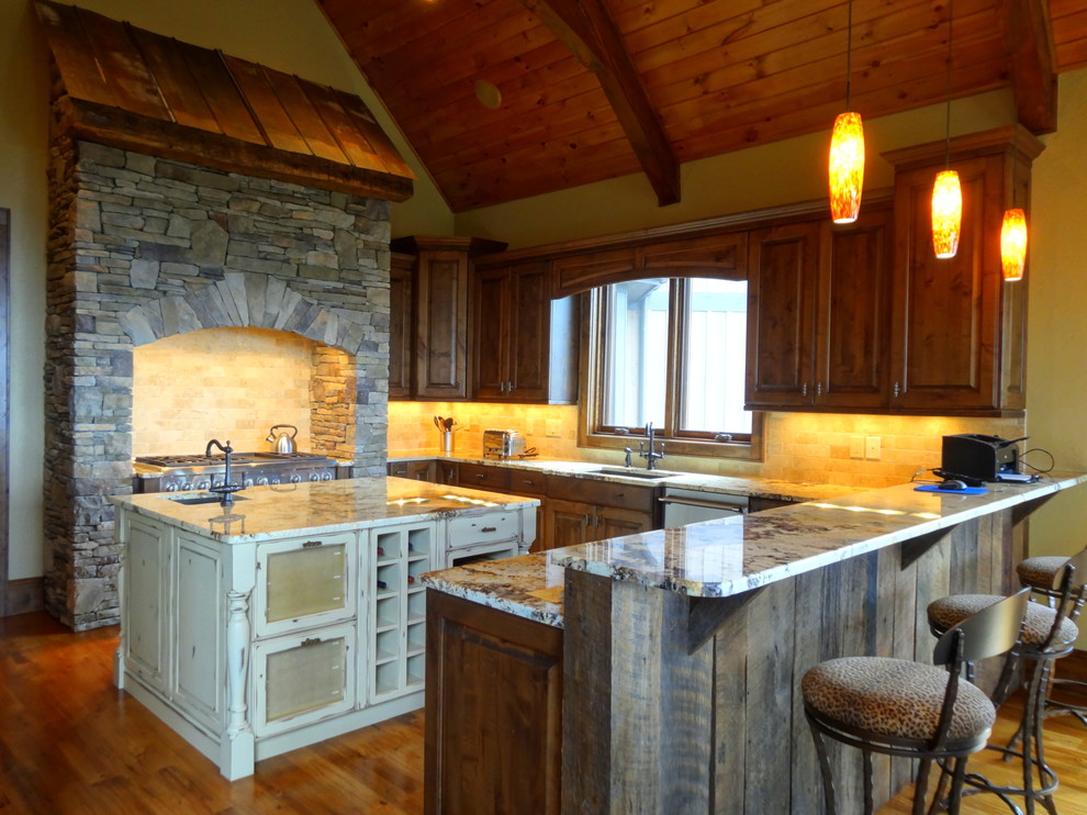 Large mountain style u-shaped medium tone wood floor eat-in kitchen photo in Charlotte with an undermount sink, raised-panel cabinets, medium tone wood cabinets, marble countertops, beige backsplash, ceramic backsplash, stainless steel appliances and an island