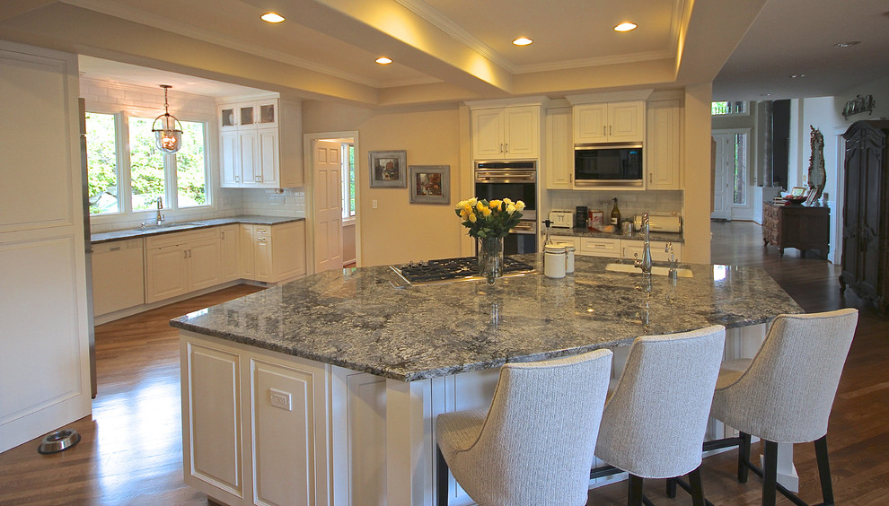 Classic grey and cream kitchen in Seattle with an integrated sink.