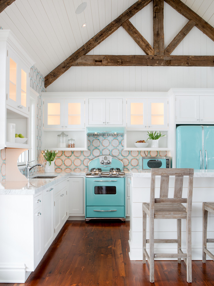 Small beach style l-shaped medium tone wood floor open concept kitchen photo in St Louis with white cabinets, multicolored backsplash, colored appliances, an island, an undermount sink, beaded inset cabinets, quartz countertops and mosaic tile backsplash