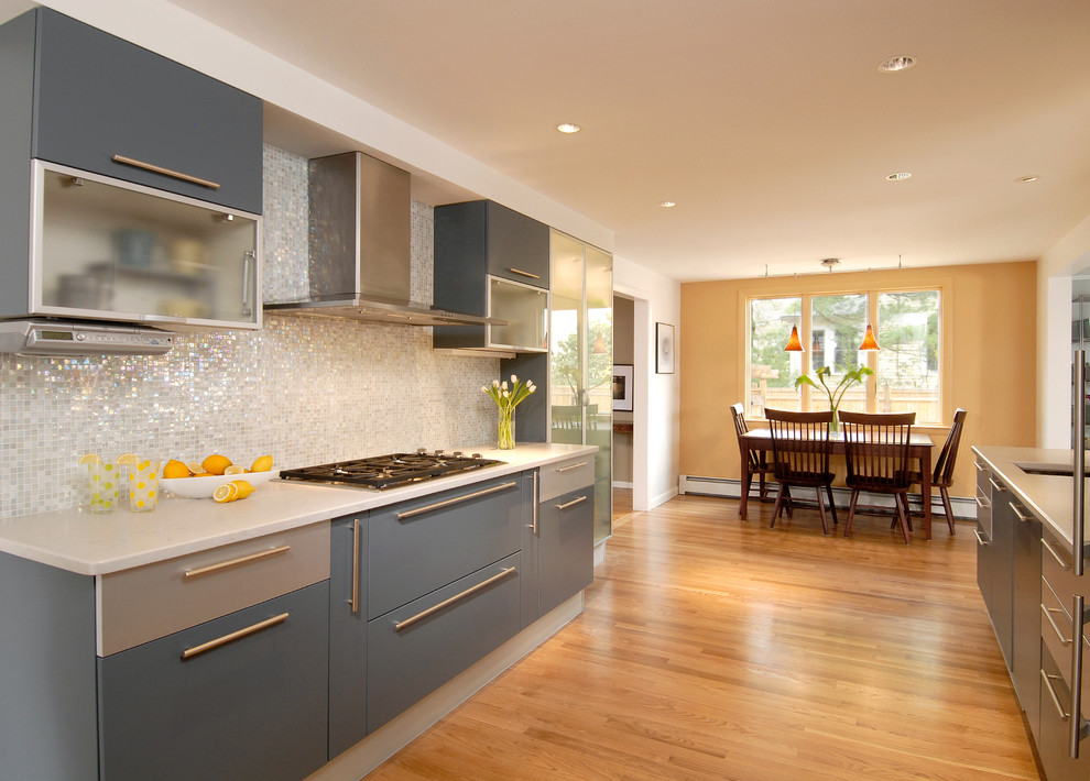 Esempio di una cucina abitabile contemporanea con lavello integrato, ante lisce, ante blu e elettrodomestici in acciaio inossidabile