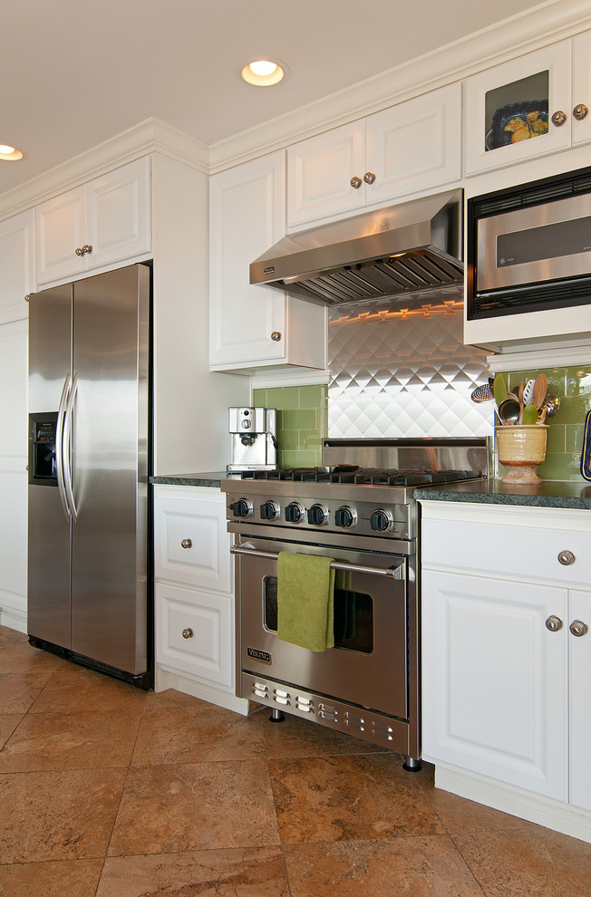 Example of an eclectic kitchen design in Denver with stainless steel appliances
