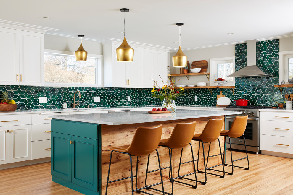 Large transitional l-shaped light wood floor and beige floor kitchen photo in Minneapolis with white cabinets, ceramic backsplash, an island, recessed-panel cabinets, green backsplash, stainless steel appliances and gray countertops