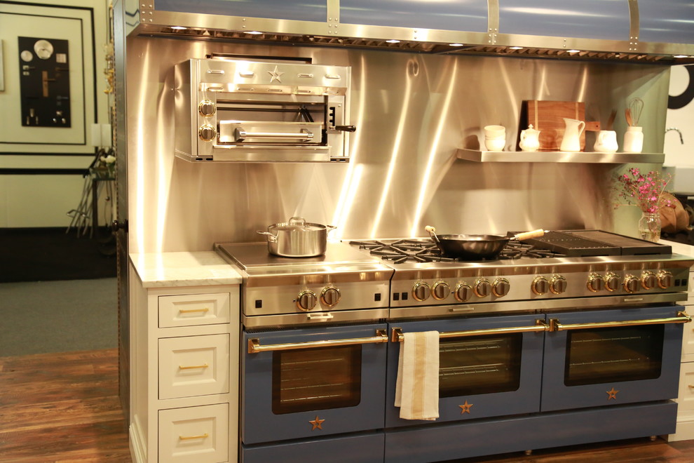 Inspiration for a huge industrial open concept kitchen remodel in New York with white cabinets and colored appliances