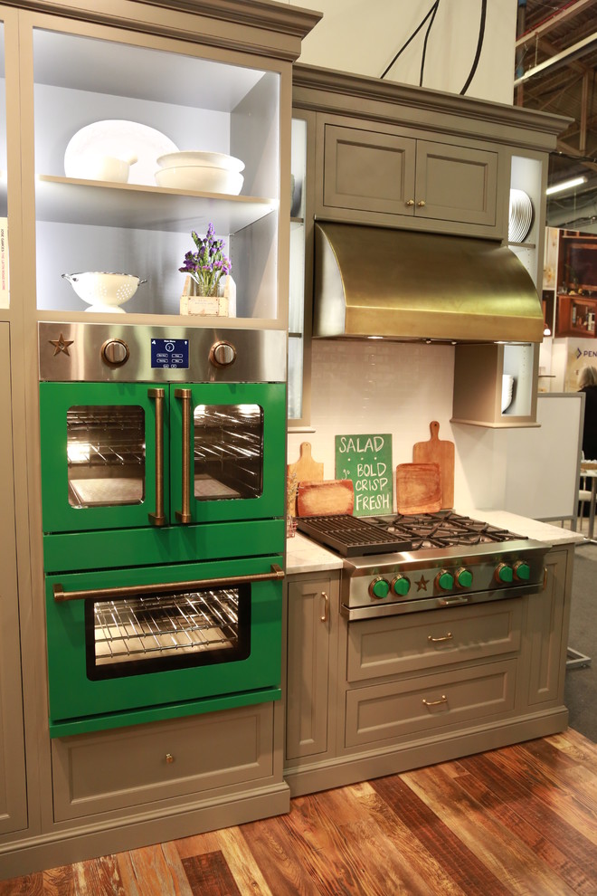 Rustic kitchen in New York with coloured appliances.