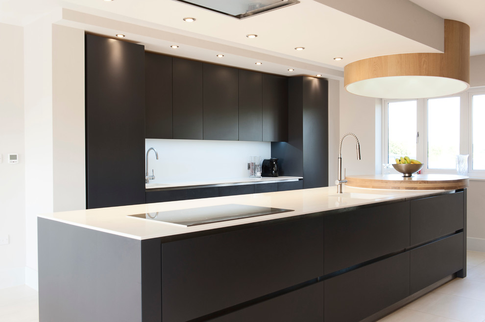 This is an example of a contemporary kitchen in Essex with tile countertops.