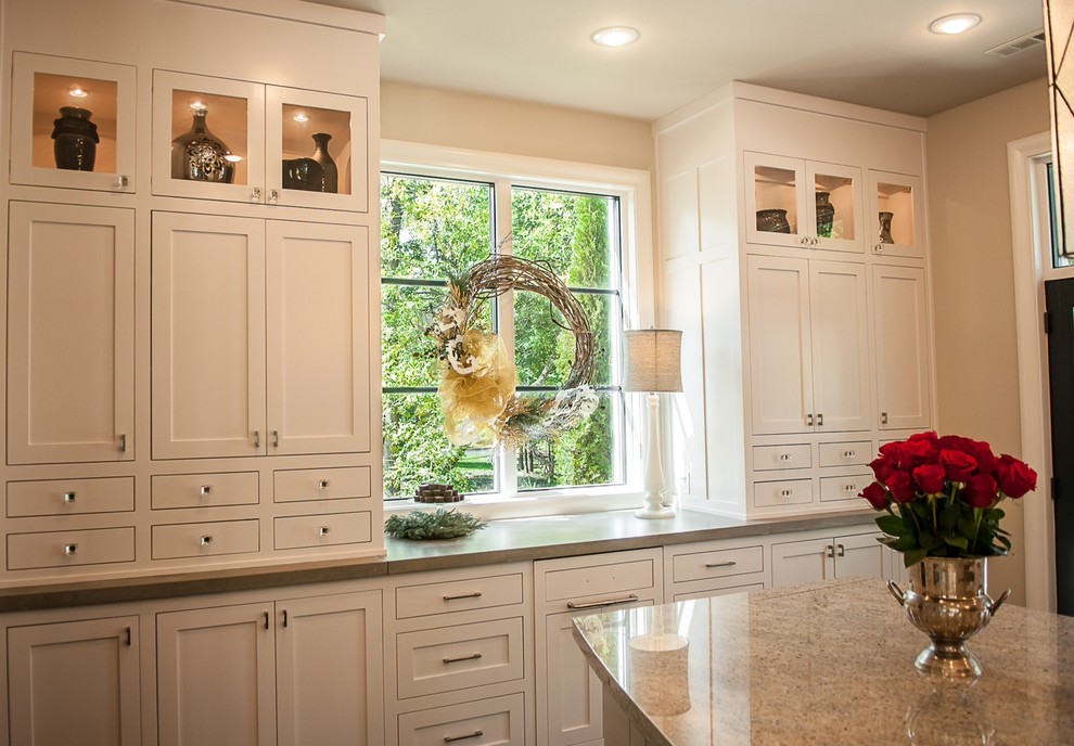 Example of a large transitional galley dark wood floor eat-in kitchen design in Other with an undermount sink, recessed-panel cabinets, white cabinets, concrete countertops, stone slab backsplash, stainless steel appliances and an island