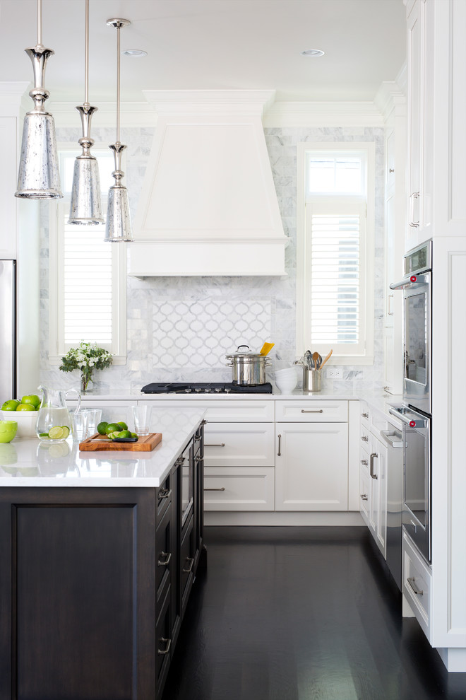 Inspiration for a transitional dark wood floor eat-in kitchen remodel in DC Metro with an undermount sink, shaker cabinets, white cabinets, multicolored backsplash, stainless steel appliances and an island