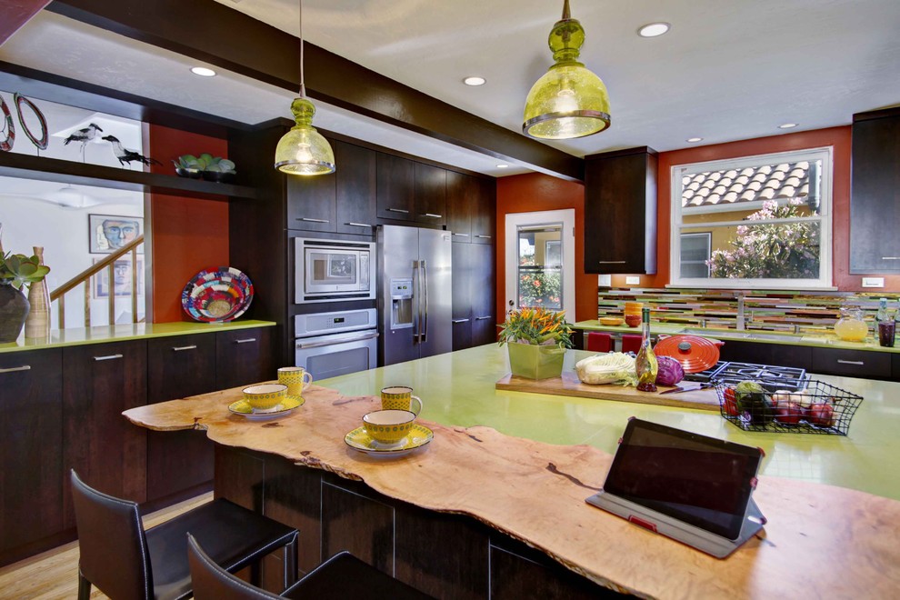 Inspiration for an eclectic kitchen remodel in San Diego with stainless steel appliances and green countertops