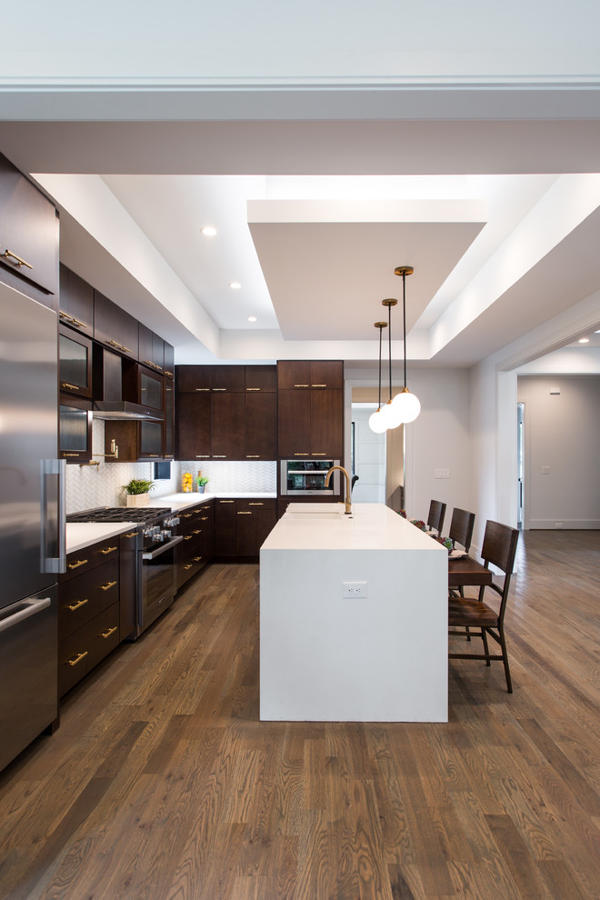 Inspiration for a large modern l-shaped medium tone wood floor and brown floor eat-in kitchen remodel in Charlotte with a farmhouse sink, flat-panel cabinets, dark wood cabinets, quartz countertops, beige backsplash, stainless steel appliances and an island