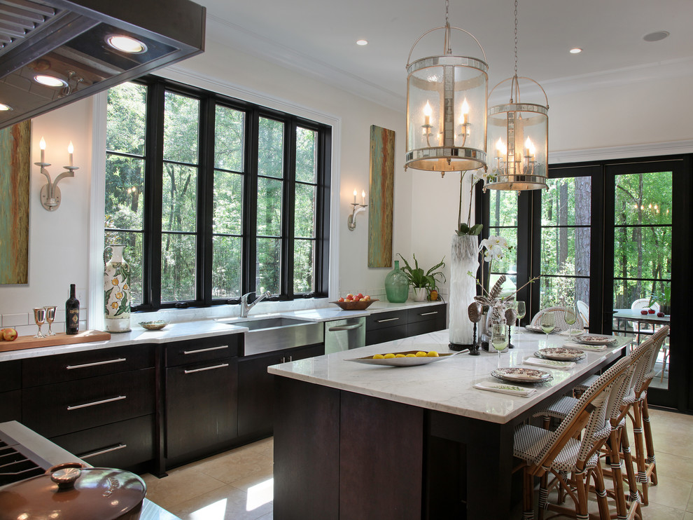 Example of a transitional kitchen design in Atlanta with a farmhouse sink, dark wood cabinets, marble countertops, white backsplash, subway tile backsplash and stainless steel appliances