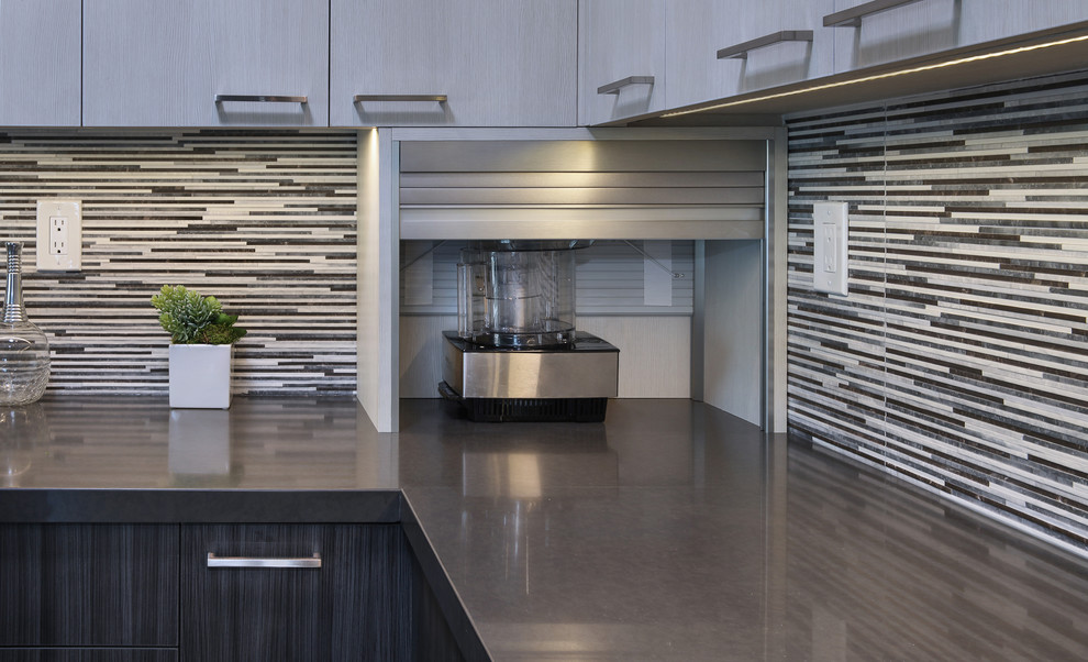 Inspiration for a mid-sized contemporary l-shaped gray floor and laminate floor eat-in kitchen remodel in Orange County with flat-panel cabinets, gray cabinets, porcelain backsplash, stainless steel appliances, an island, an undermount sink, quartz countertops and multicolored backsplash