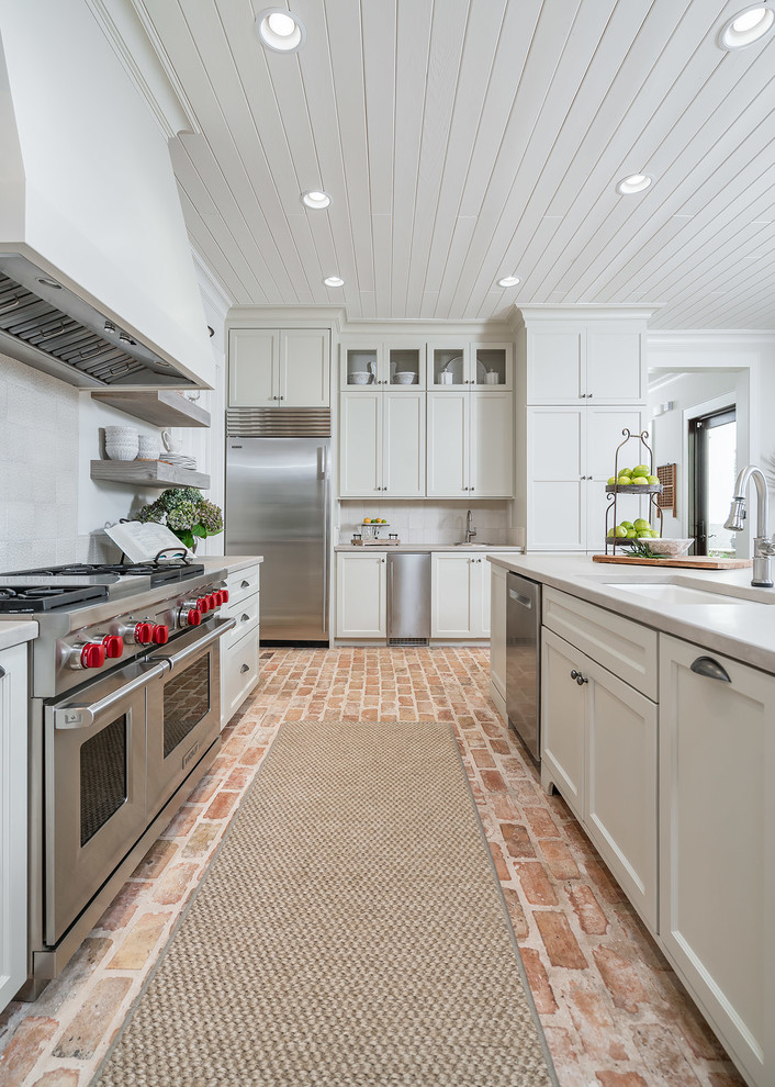 Photo of a l-shaped kitchen in Other with an island.