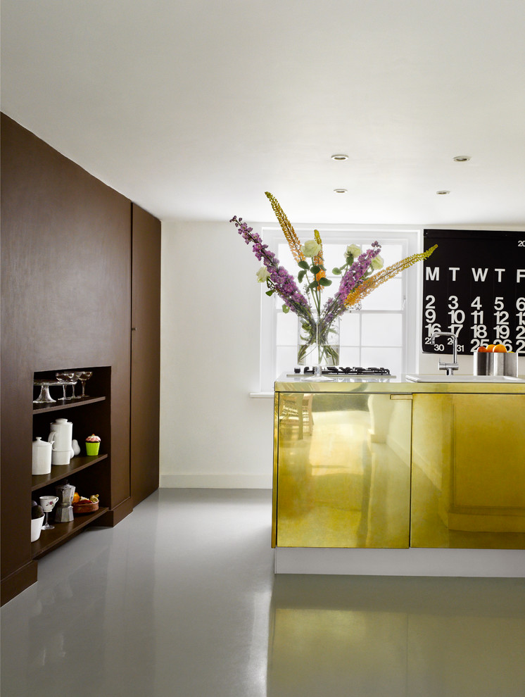 Inspiration for a contemporary kitchen in London with flat-panel cabinets and yellow cabinets.