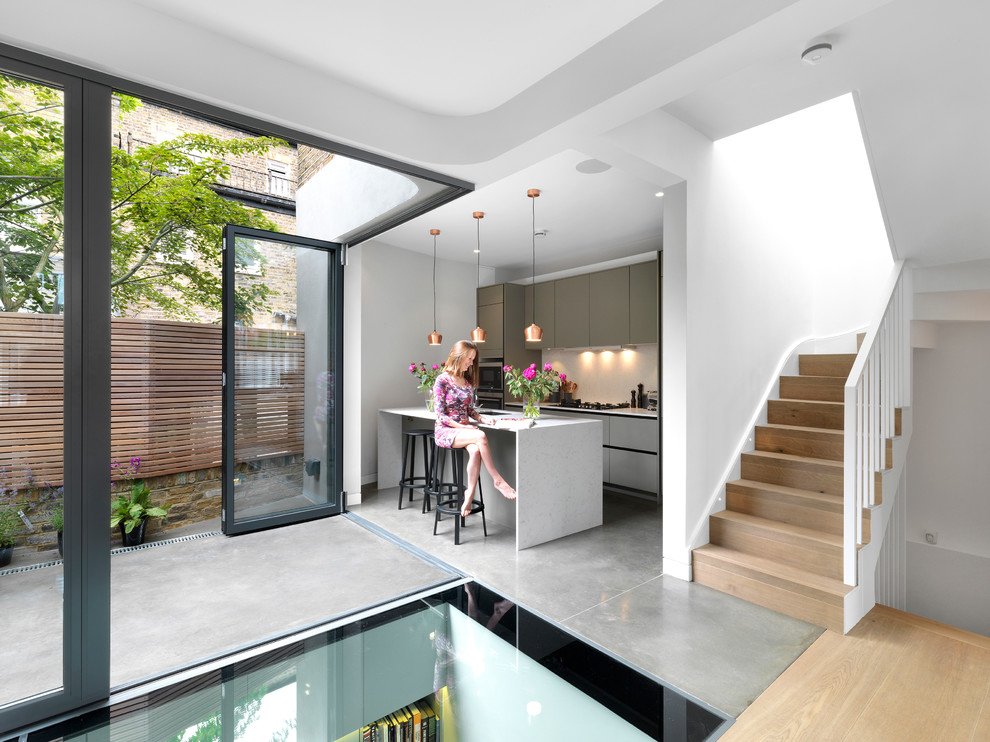 Contemporary single-wall kitchen in London with an island.