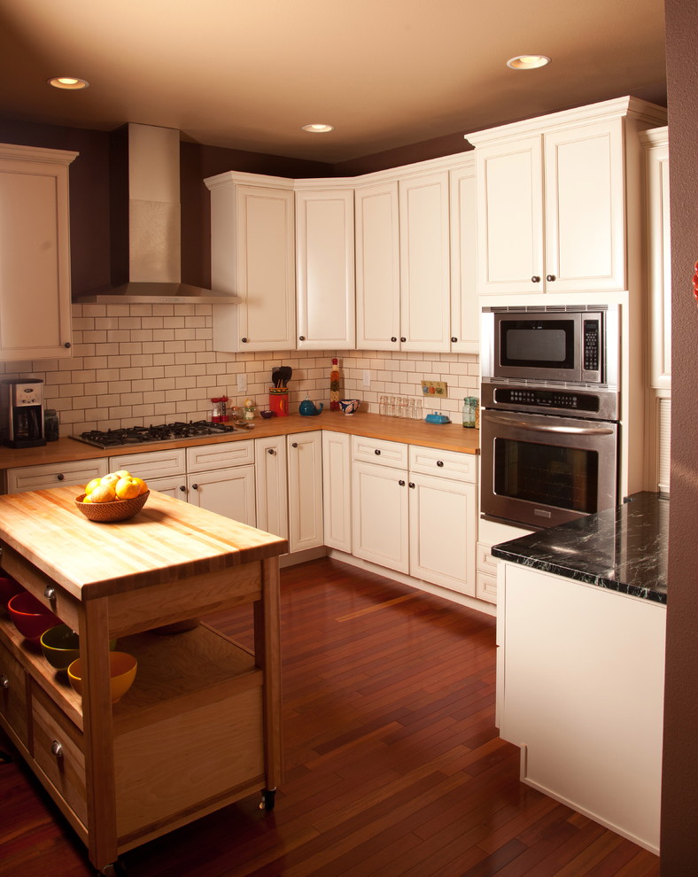 Photo of a traditional kitchen in Denver with metro tiled splashback and stainless steel appliances.