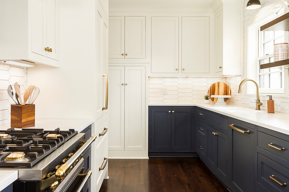 Eat-in kitchen - mid-sized transitional u-shaped dark wood floor and brown floor eat-in kitchen idea in Minneapolis with an undermount sink, shaker cabinets, white cabinets, quartz countertops, white backsplash, ceramic backsplash, paneled appliances and no island