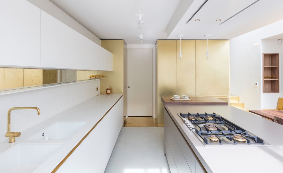 Inspiration for a contemporary galley kitchen/diner in Other with a double-bowl sink, flat-panel cabinets, white cabinets, mirror splashback, an island, white floors and white worktops.