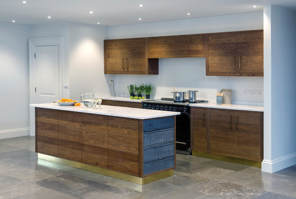 This is an example of an expansive contemporary open plan kitchen in Sussex with a submerged sink, flat-panel cabinets, dark wood cabinets, marble worktops, white splashback, marble splashback, integrated appliances, ceramic flooring, multiple islands and grey floors.