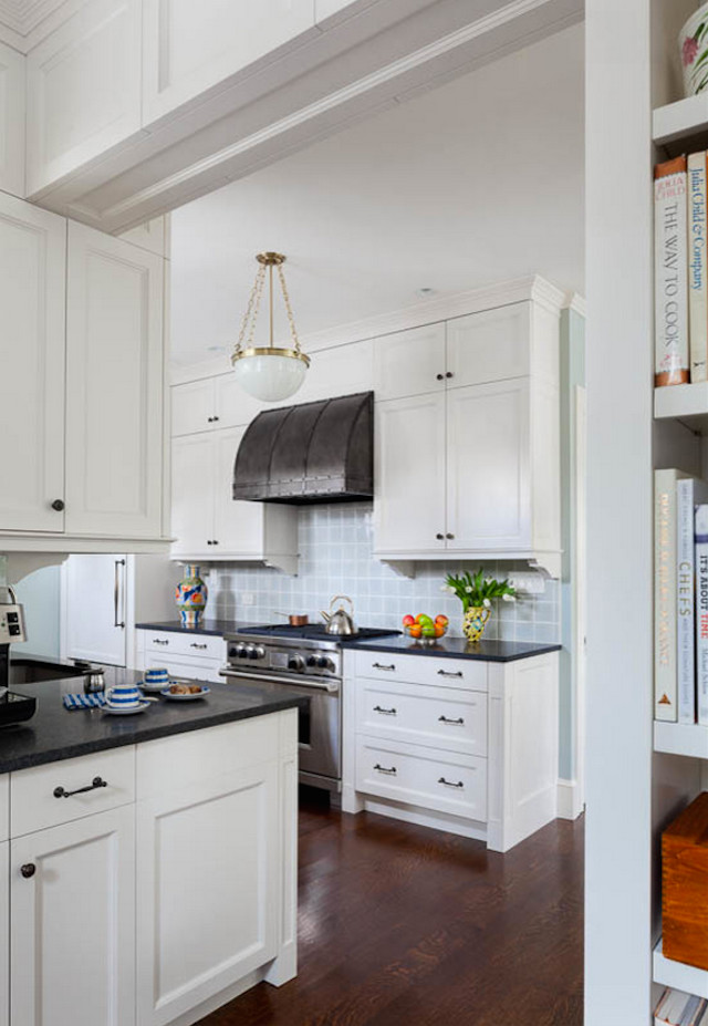 Large transitional l-shaped dark wood floor eat-in kitchen photo in Boston with white cabinets, blue backsplash, an undermount sink, shaker cabinets, glass tile backsplash, stainless steel appliances and no island