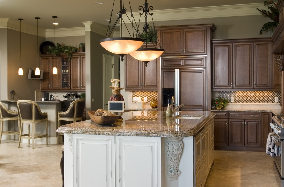 Example of a huge classic ceramic tile kitchen design in Charleston with beige cabinets, granite countertops, beige backsplash, an island, an undermount sink, raised-panel cabinets, mosaic tile backsplash and paneled appliances