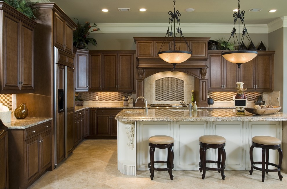 Design ideas for an expansive traditional kitchen in Atlanta with beige cabinets, granite worktops, beige splashback, stainless steel appliances, an island, a submerged sink, raised-panel cabinets, mosaic tiled splashback and ceramic flooring.
