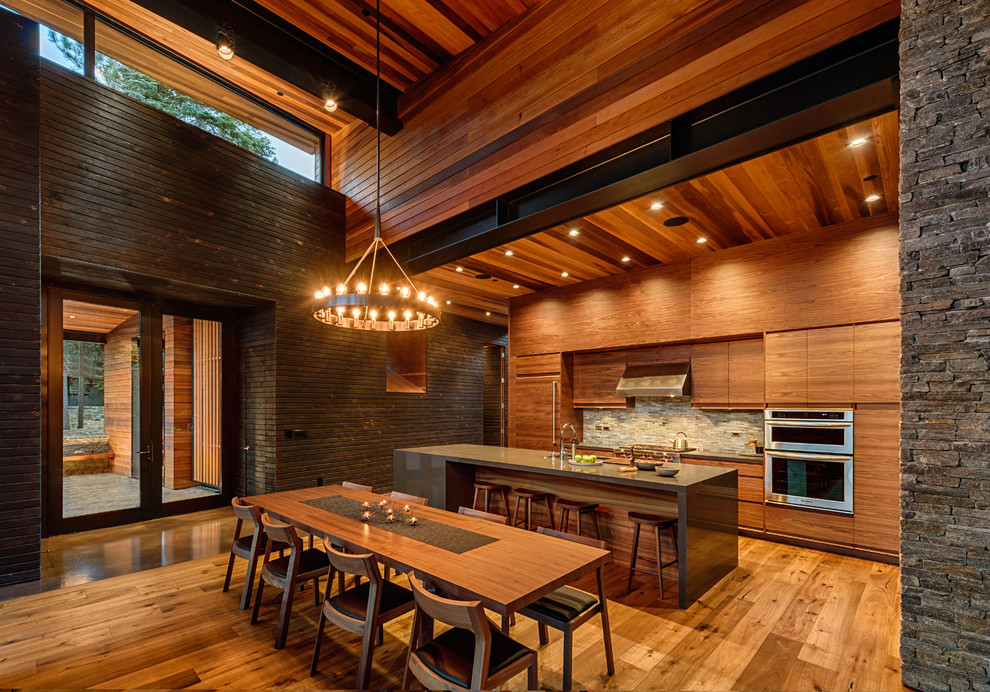 Trendy galley eat-in kitchen photo in San Francisco with flat-panel cabinets, medium tone wood cabinets, multicolored backsplash, mosaic tile backsplash and stainless steel appliances