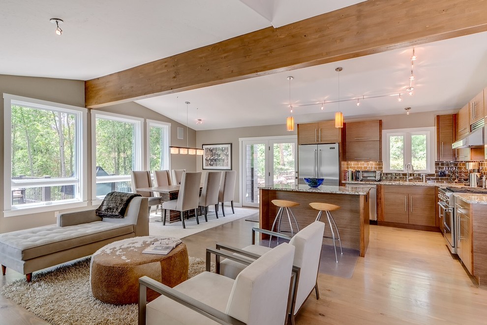 Open concept kitchen - contemporary l-shaped open concept kitchen idea in Denver with flat-panel cabinets, medium tone wood cabinets, brown backsplash, subway tile backsplash and stainless steel appliances