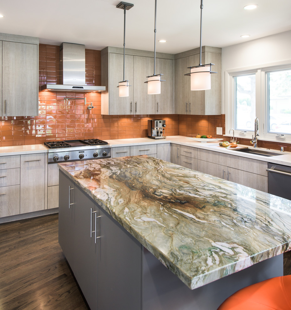 Huge trendy u-shaped dark wood floor and brown floor eat-in kitchen photo in Los Angeles with an undermount sink, flat-panel cabinets, gray cabinets, quartzite countertops, orange backsplash, glass tile backsplash, stainless steel appliances and an island